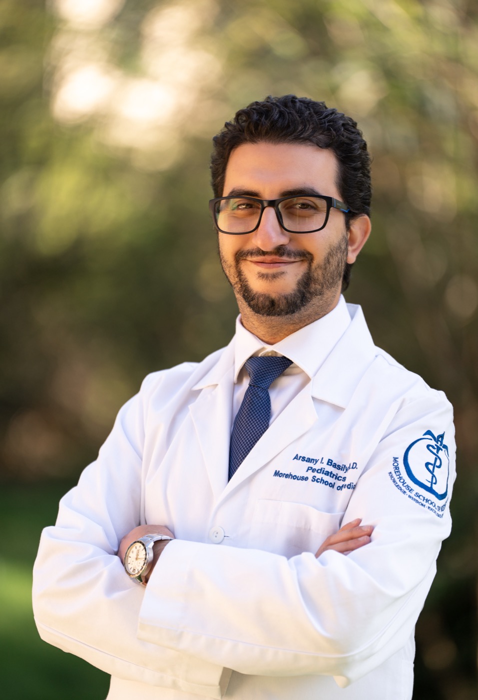 Dr. Arsany Basily wearing a white coat
